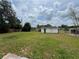 Large grassy backyard with a storage shed and plenty of open space at 2808 Drake Dr, Orlando, FL 32810