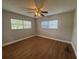 A light-filled room is enhanced by warm wood floors and soothing neutral wall tones at 2808 Drake Dr, Orlando, FL 32810