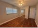 Inviting bedroom with wood floors, ceiling fan, and large windows at 2808 Drake Dr, Orlando, FL 32810
