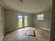 The bonus room features tile flooring, and glass doors leading to the backyard at 2808 Drake Dr, Orlando, FL 32810