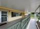 Inviting covered porch with green railing, and a welcoming door at 2808 Drake Dr, Orlando, FL 32810