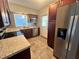 Modern kitchen with stainless steel appliances, granite countertops, and ample cabinet space at 2808 Drake Dr, Orlando, FL 32810