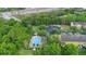 Aerial view featuring community pool, townhomes, green landscape and parking at 2829 Shady Willow Ln, Oviedo, FL 32765