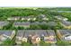 An aerial view of a townhouse community surrounded by lush greenery at 2829 Shady Willow Ln, Oviedo, FL 32765