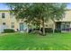 Grassy backyard with a tree providing shade, perfect for relaxing outdoors at 2829 Shady Willow Ln, Oviedo, FL 32765