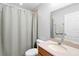 Clean bathroom with shower curtain, standard toilet, and vanity at 2829 Shady Willow Ln, Oviedo, FL 32765