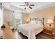 Comfortable bedroom features a ceiling fan and a decorative tray ceiling at 2829 Shady Willow Ln, Oviedo, FL 32765