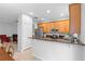 Open kitchen with stainless appliances and breakfast bar; living area is visible in background at 2829 Shady Willow Ln, Oviedo, FL 32765