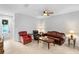 Inviting living room with leather furniture, tile floors, and a ceiling fan for comfortable living at 2829 Shady Willow Ln, Oviedo, FL 32765