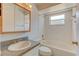 Bathroom featuring a tub-shower, granite sink top, and a framed mirror at 289 N Wilderness Pt, Casselberry, FL 32707