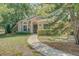 Charming single-story home featuring manicured landscaping and a welcoming walkway at 289 N Wilderness Pt, Casselberry, FL 32707
