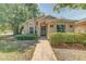 Charming single-story home featuring manicured landscaping and a welcoming walkway at 289 N Wilderness Pt, Casselberry, FL 32707