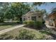 Charming single-story home featuring manicured landscaping and a welcoming walkway at 289 N Wilderness Pt, Casselberry, FL 32707