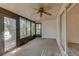 Enclosed lanai with ceiling fan and views of lush greenery at 289 N Wilderness Pt, Casselberry, FL 32707