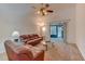 Comfortable living room with ceiling fan and sliding glass door to lanai at 289 N Wilderness Pt, Casselberry, FL 32707