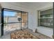 View of the screened porch featuring a carpet, textured walls, and screen windows offering outdoor views at 289 N Wilderness Pt, Casselberry, FL 32707