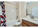 Well-lit bathroom features a shower-tub combo and a sleek vanity at 2999 Buccaneer Palm Rd, Kissimmee, FL 34747