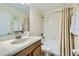 Well-maintained bathroom featuring a shower-tub combo and a single vanity with storage at 2999 Buccaneer Palm Rd, Kissimmee, FL 34747
