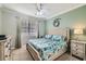 Serene bedroom with neutral tones, ceiling fan, and large window for natural light at 2999 Buccaneer Palm Rd, Kissimmee, FL 34747