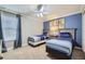 Comfortable bedroom featuring two twin beds, carpet floors and a double window at 2999 Buccaneer Palm Rd, Kissimmee, FL 34747