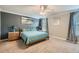 Relaxing bedroom featuring neutral walls, carpet, and a comfortable queen-size bed at 2999 Buccaneer Palm Rd, Kissimmee, FL 34747