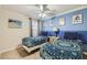 Comfortable bedroom offers two twin beds, accent wall, and bedside tables at 2999 Buccaneer Palm Rd, Kissimmee, FL 34747