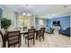 Elegant dining area with ample seating and natural light, perfect for gatherings at 2999 Buccaneer Palm Rd, Kissimmee, FL 34747