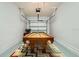 Features a billiards table with a vibrant zig zag patterned rug on a light colored floor at 2999 Buccaneer Palm Rd, Kissimmee, FL 34747