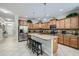 Spacious kitchen with stainless steel appliances, granite countertops, and a functional center island at 2999 Buccaneer Palm Rd, Kissimmee, FL 34747