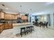 Modern kitchen with granite countertops, stainless steel appliances, and island seating at 2999 Buccaneer Palm Rd, Kissimmee, FL 34747