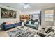 Open-concept living area showcasing seamless transition to kitchen and dining space at 2999 Buccaneer Palm Rd, Kissimmee, FL 34747