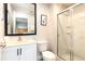 Modern bathroom with a shower, white vanity, and modern fixtures at 3069 White Orchid Rd, Kissimmee, FL 34747