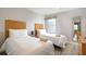 Bright bedroom with two twin beds, contemporary decor, and plenty of natural light at 3069 White Orchid Rd, Kissimmee, FL 34747