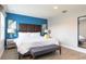 Bright bedroom with a king-sized bed, modern decor, and plenty of natural light at 3069 White Orchid Rd, Kissimmee, FL 34747