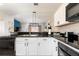 Well-equipped kitchen featuring granite countertops, white cabinets, and modern appliances at 3069 White Orchid Rd, Kissimmee, FL 34747