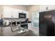 Spacious kitchen featuring stainless steel appliances, granite countertops, and ample natural light at 3069 White Orchid Rd, Kissimmee, FL 34747