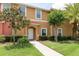 This beautiful townhouse offers a tile roof, green grass, and well-maintained shrubs at 3069 White Orchid Rd, Kissimmee, FL 34747