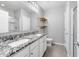 Stylish bathroom featuring granite countertop vanity with double sinks, a shower, and tile flooring at 312 Arbor Lakes Dr, Davenport, FL 33896