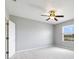 Clean and well-lit bedroom with a ceiling fan and neutral paint at 312 Arbor Lakes Dr, Davenport, FL 33896