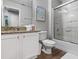 Bright bathroom with granite counters, white cabinets, tub shower combo, and modern fixtures at 3193 Yellow Lantana Ln, Kissimmee, FL 34747