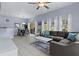 Comfortable living room and dining area with neutral colors, open layout, and bright natural light at 3193 Yellow Lantana Ln, Kissimmee, FL 34747
