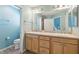 Bathroom featuring double sinks, modern lighting fixtures, and separate toilet area at 3198 Abana Path, The Villages, FL 32163