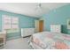 Comfortable bedroom with a ceiling fan, and large window to let in natural light at 3198 Abana Path, The Villages, FL 32163