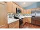 Well-equipped kitchen featuring stainless steel appliances and ample counter space at 3198 Abana Path, The Villages, FL 32163