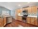 Modern kitchen with stainless steel appliances, tile backsplash, and lots of cabinet space at 3198 Abana Path, The Villages, FL 32163