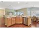 Kitchen with wrap-around counter, stainless steel appliances, and adjacent dining area at 3198 Abana Path, The Villages, FL 32163