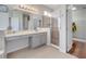 Bathroom featuring a glass-enclosed shower and a vanity with ample counter space at 3380 Pawleys N Loop, St Cloud, FL 34769