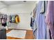Walk-in closet with rods and shelves for efficient clothing storage at 3380 Pawleys N Loop, St Cloud, FL 34769