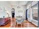 Bright dining room features wood floors, chandelier, natural light, and flows into the kitchen at 3380 Pawleys N Loop, St Cloud, FL 34769