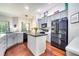 Modern kitchen features stainless steel appliances, granite countertops, and a center island at 3380 Pawleys N Loop, St Cloud, FL 34769
